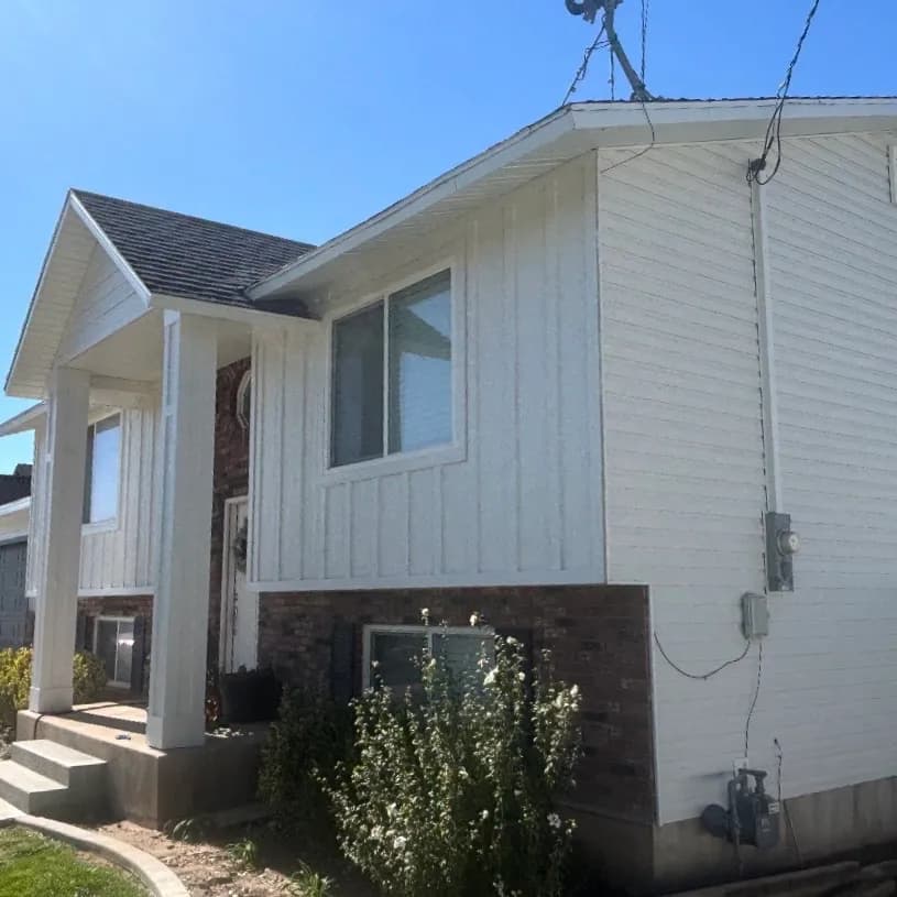 White siding with brick accent