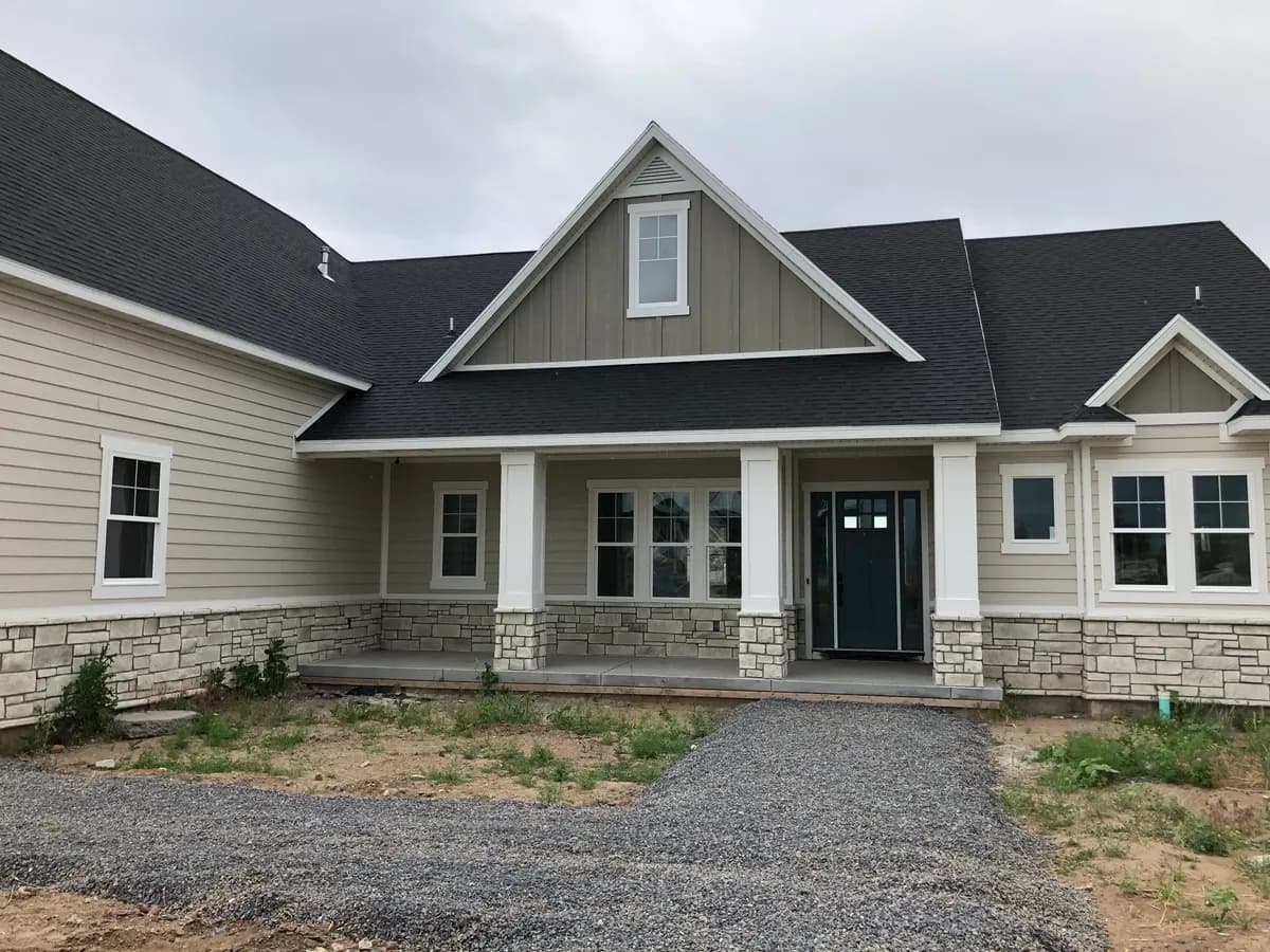 Craftsman style home with stone accent